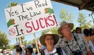 Thousands defy heat, walk winding route to protest SB 1070 in Phoenix